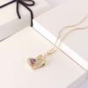 Heart shaped pendant necklace with purple stone