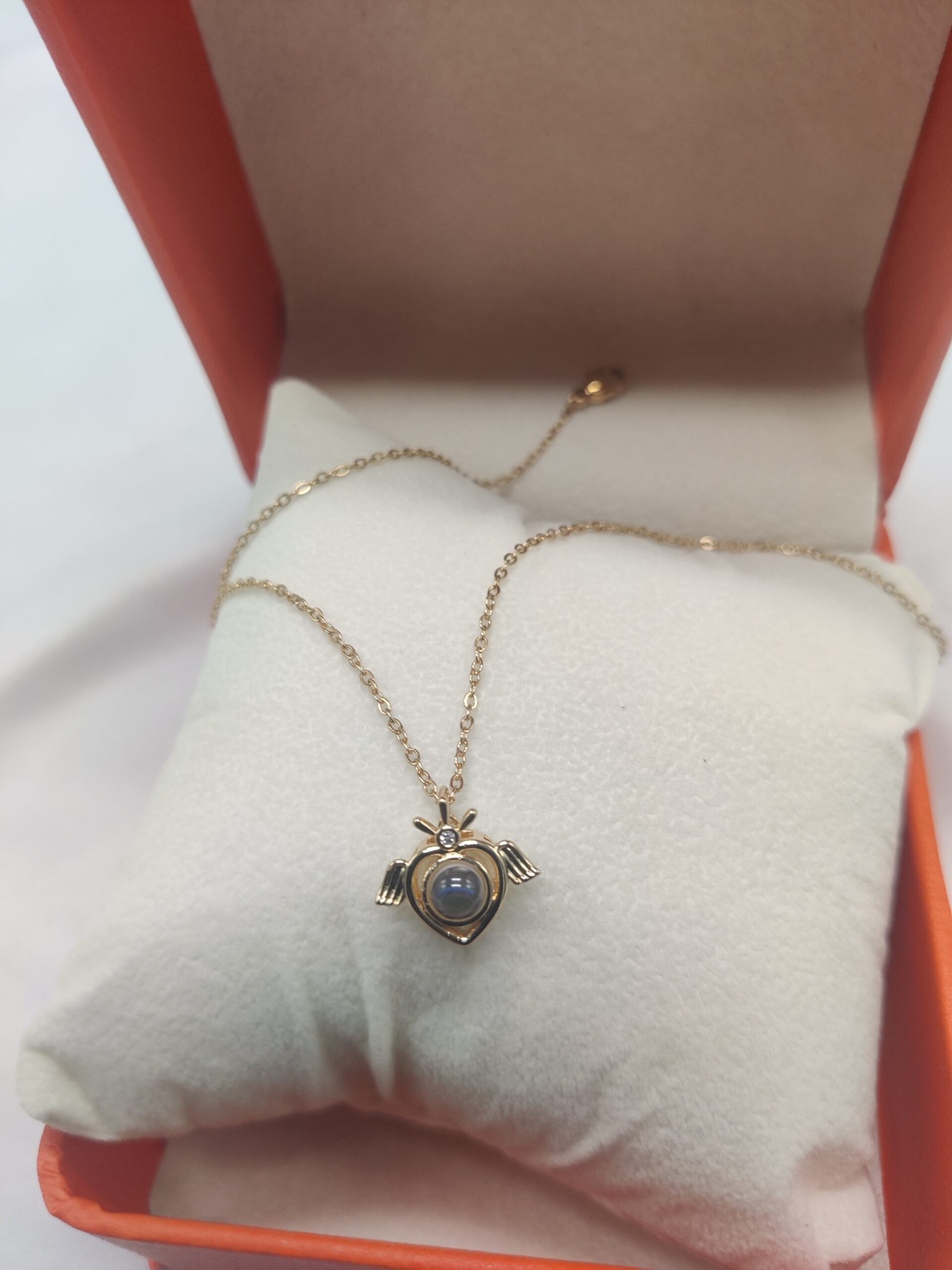Heart shaped crystal ball necklace with wings